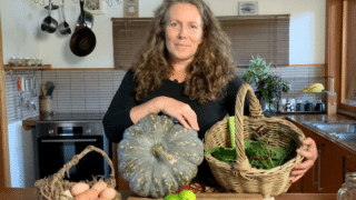 Morag Gamble holds produce from her garden