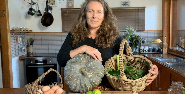 Morag Gamble holds produce from her garden